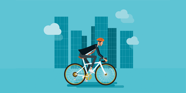 employee-riding-bicycle-through-city